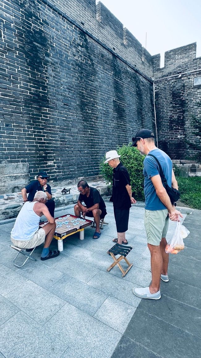 Chinese chess in front of the fortress wall