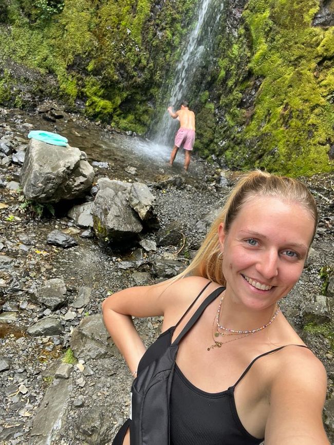 Tobi showering under a waterfall in Hanmer Springs