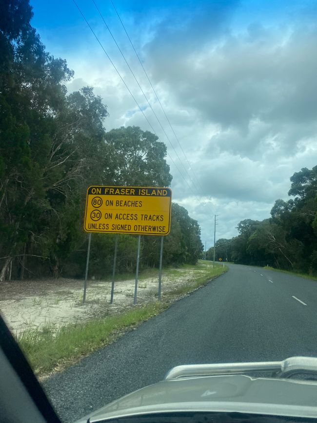 Road sign in front of Fraser Island 