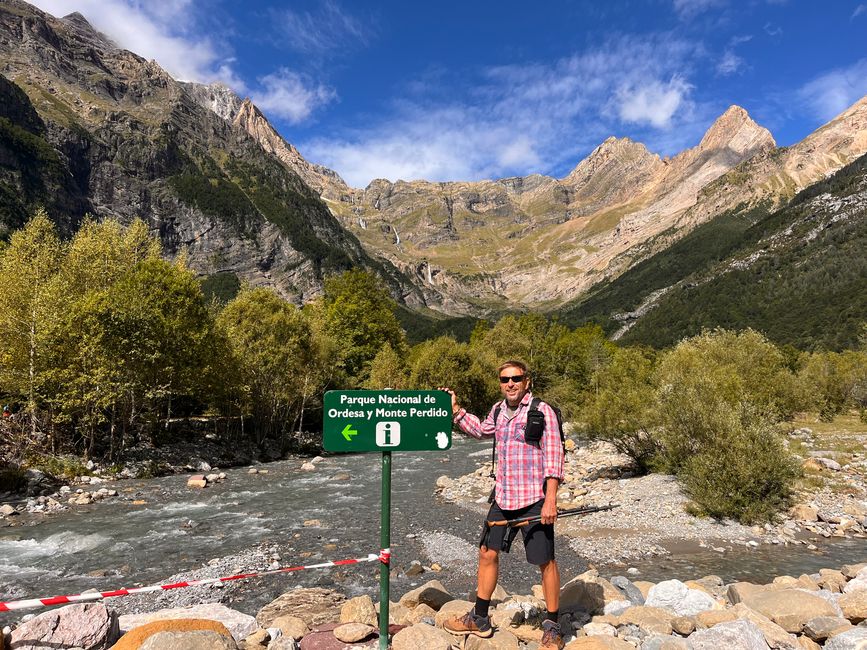 Let's go with hiking shoes, trekking poles, and checkered shirt ;-)