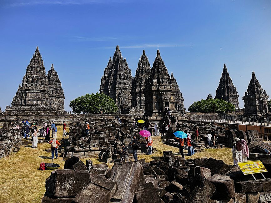Prambanes, with ruins of a small temple in the foreground.