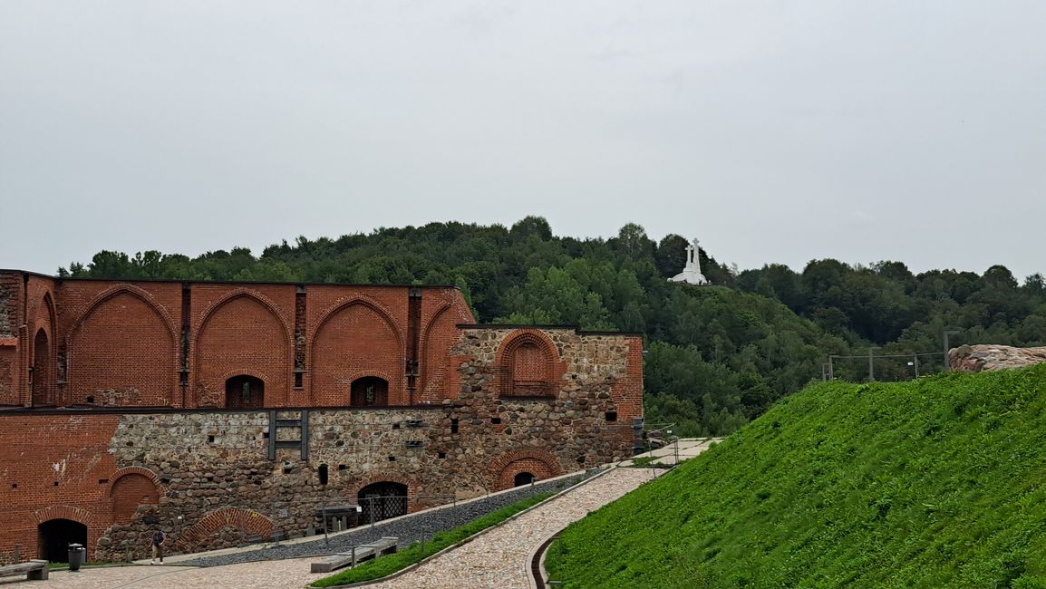 Castle ruins with the three crosses in the background 