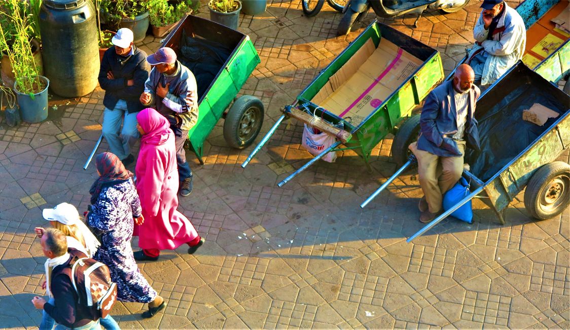 Djemaa el Fna from above, the men wait for customers to transport purchases like carpets, larger furniture.