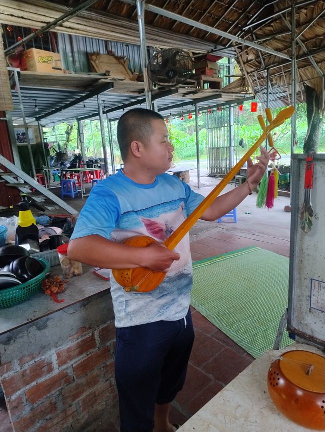Leo plays Vietnamese banjo
