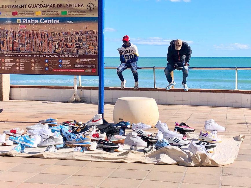 Shoe sellers on the promenade.