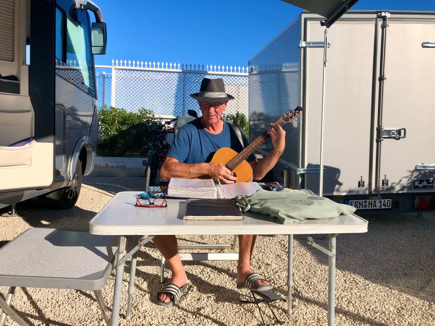 A farewell song. This cowboy played and sang classic oldies at the campsite.