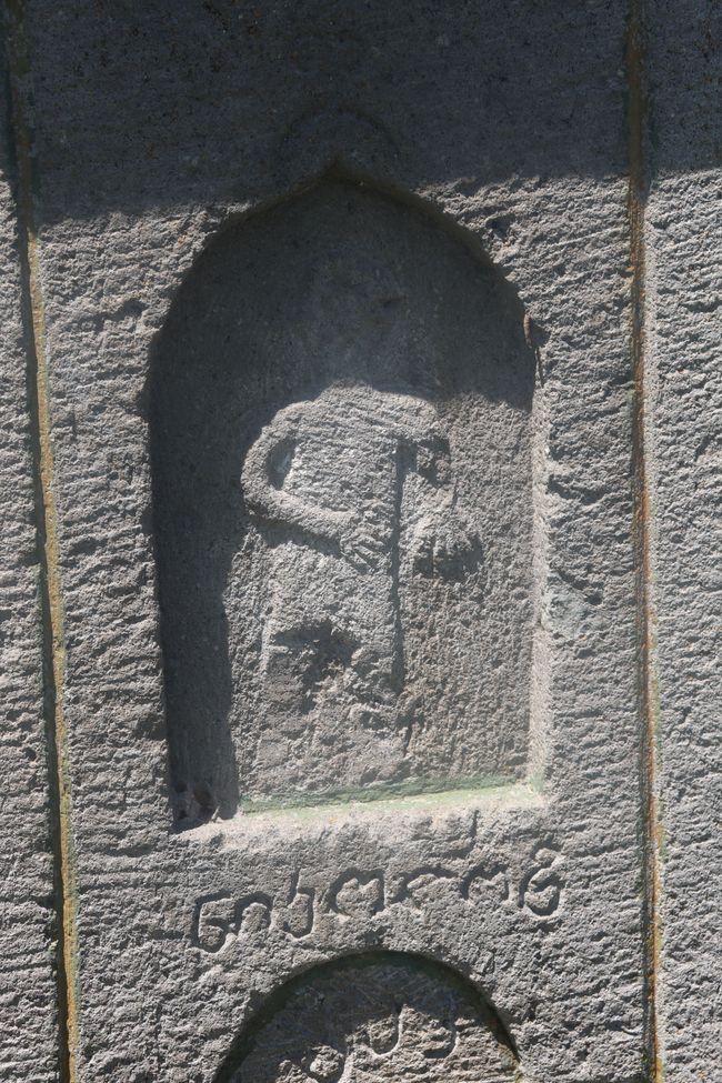 Interesting relief on a stone cross
