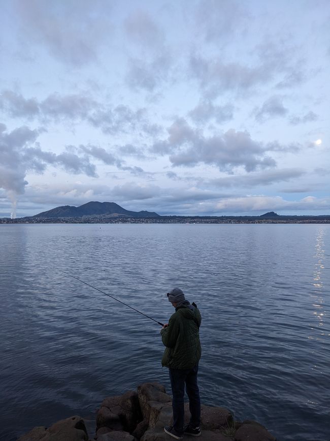 Fishing with a view on the City Taupō.