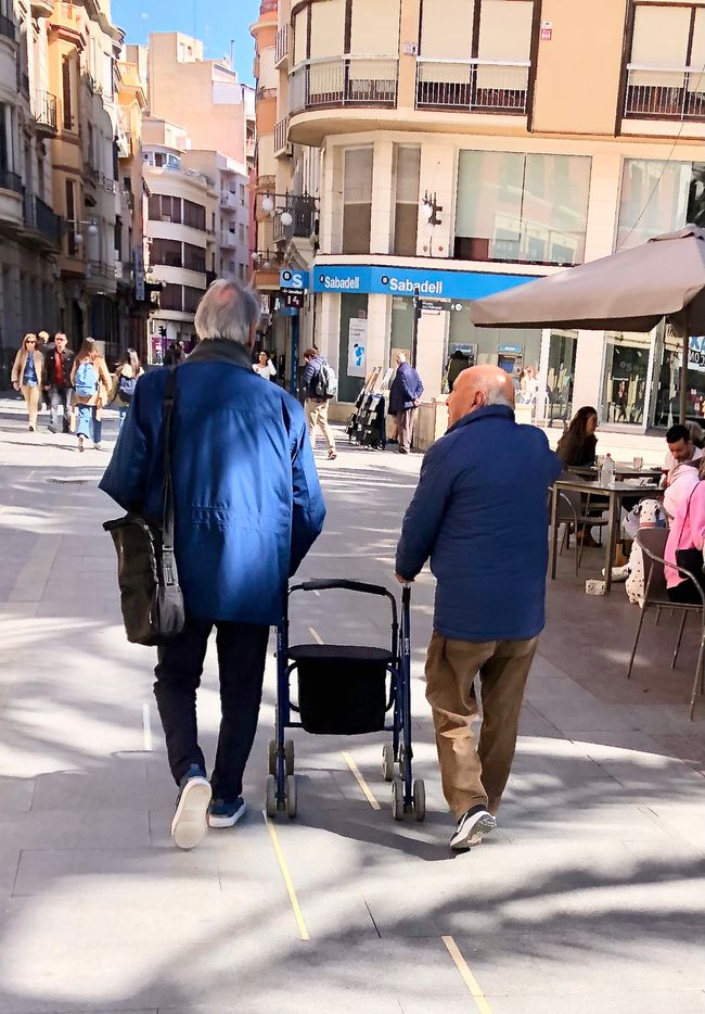 Spaniards share everything – even the walker.