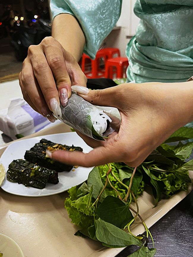 Jessica wraps the food in rice paper