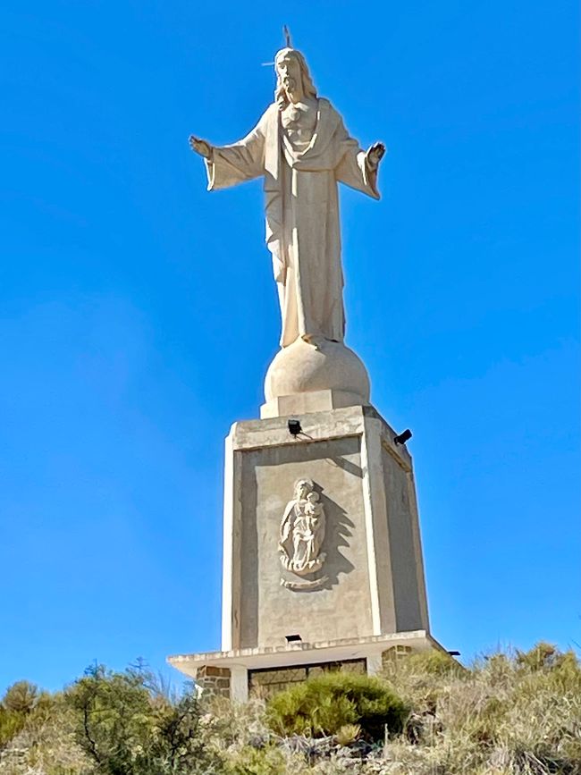 There is a statue of Christ on the summit.