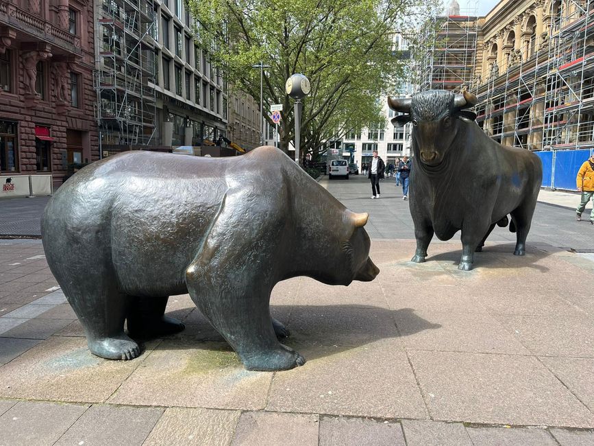 Bear and bull in front of the stock exchange. They both have some meaning, but I've forgotten what.