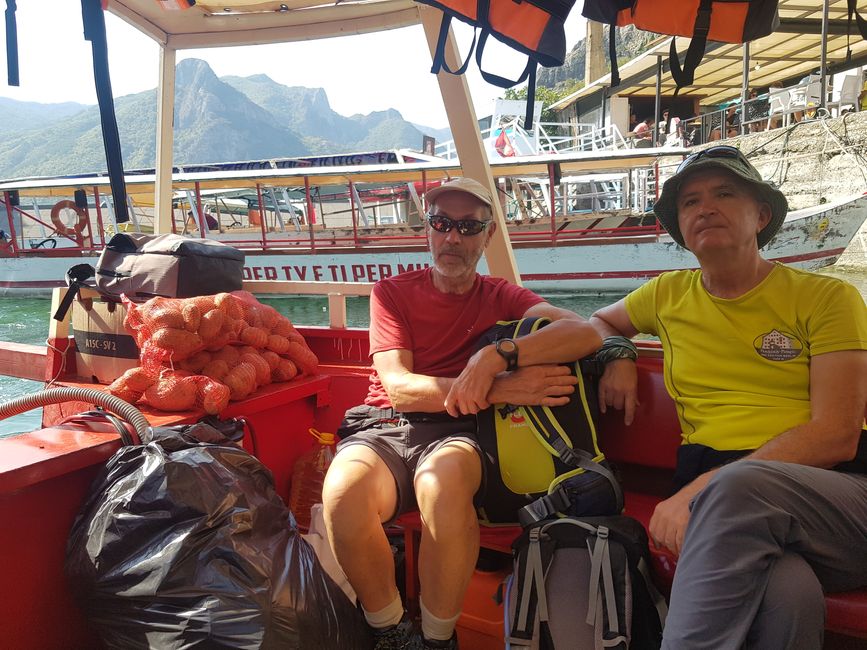 Everything is transported on Lake Koman... Passengers next to a sack of potatoes