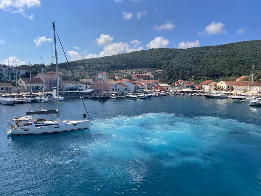 The departing ferry has stirred up the harbor