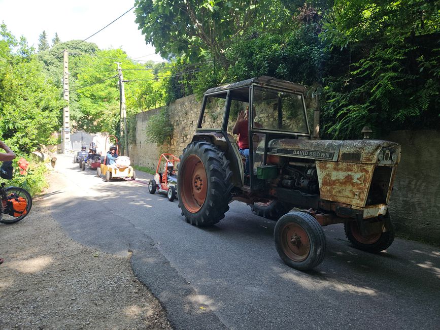 Soapboxes being towed to the starting point