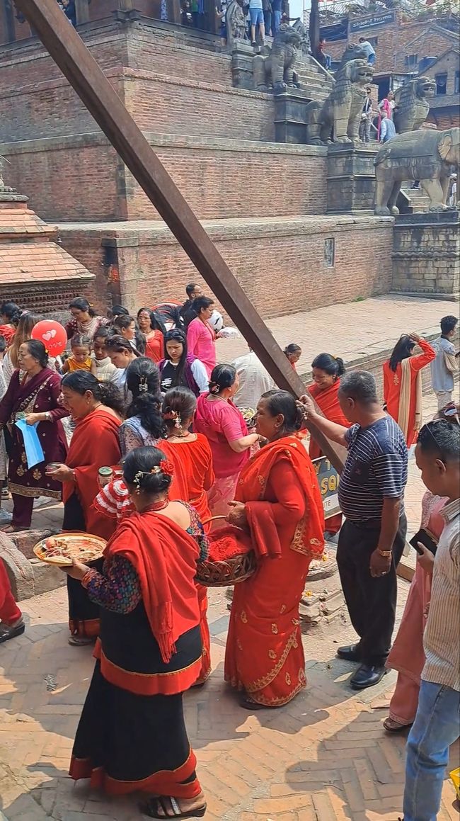 Women making sacrifices at a temple site.