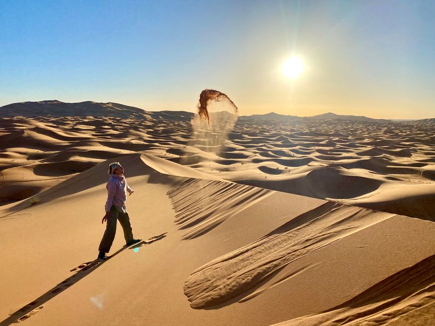 Flowing sand at the edge of a dune