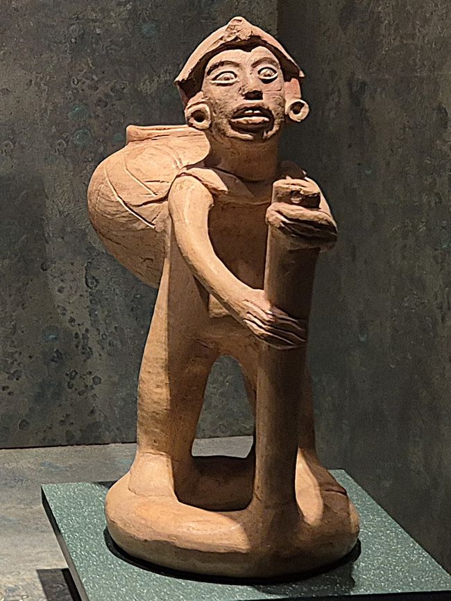 Estatua de terracota maya del Cargador