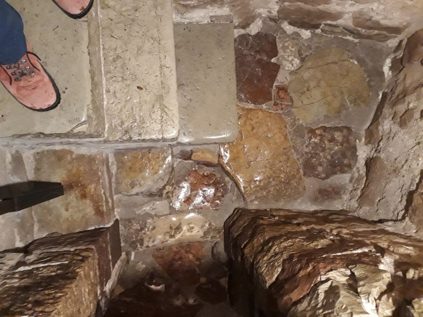 A steep staircase carved into the rock at the Eremo Carceri leading to the Franciscan grotto