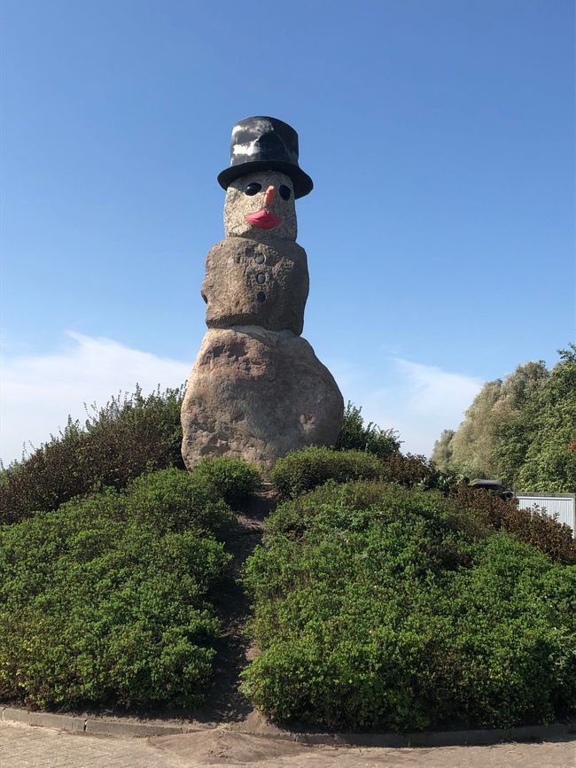 A snowman made of boulders