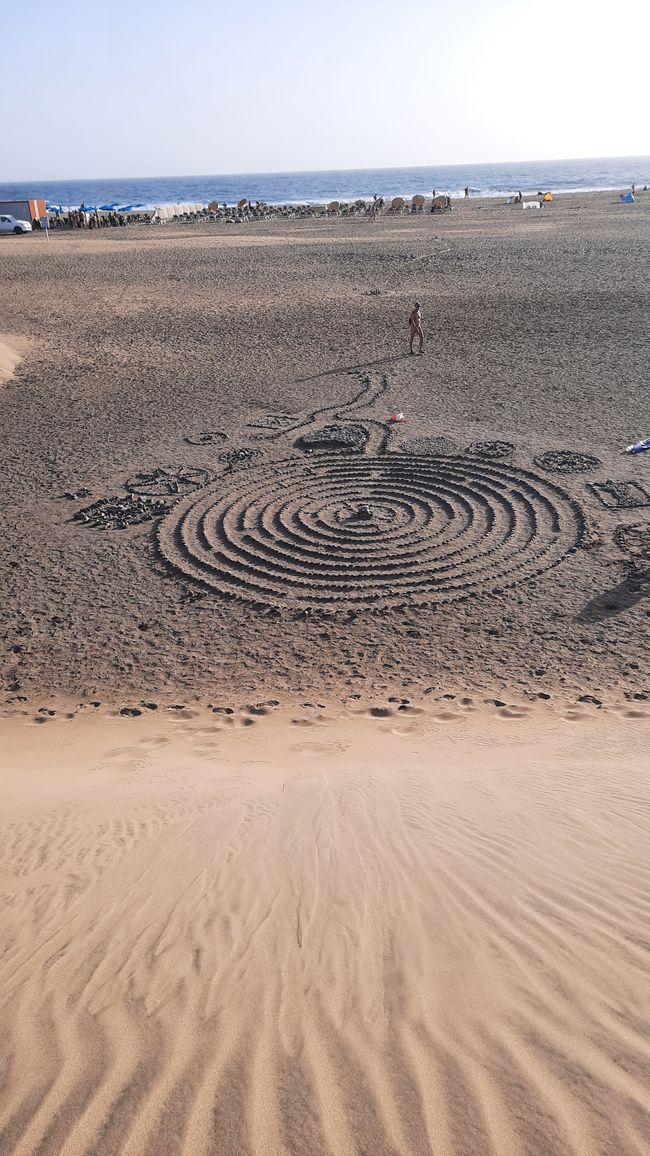 The artist creates the stone labyrinth