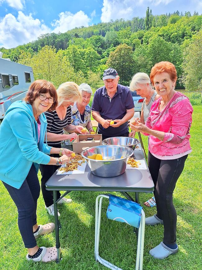 Irmi, Rita, Heidi, Gerd, Christl and Ute (from left) peeling potatoes.