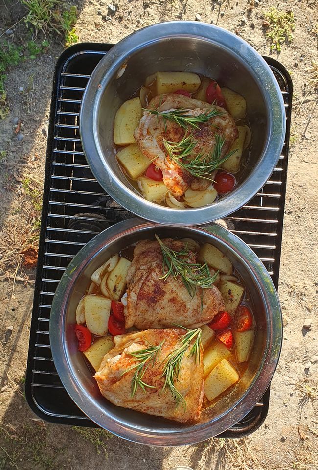 Chicken braised on potatoes in the oven